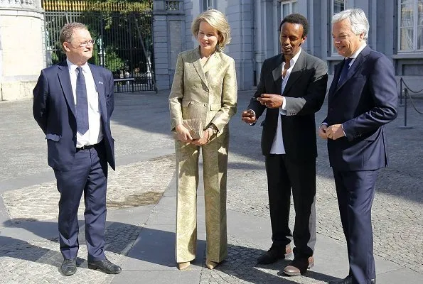 Queen Mathilde attended the official opening of Africa Museum exhibition at the Egmont Palace. Armani Collezioni floral jacquard blazer and pants