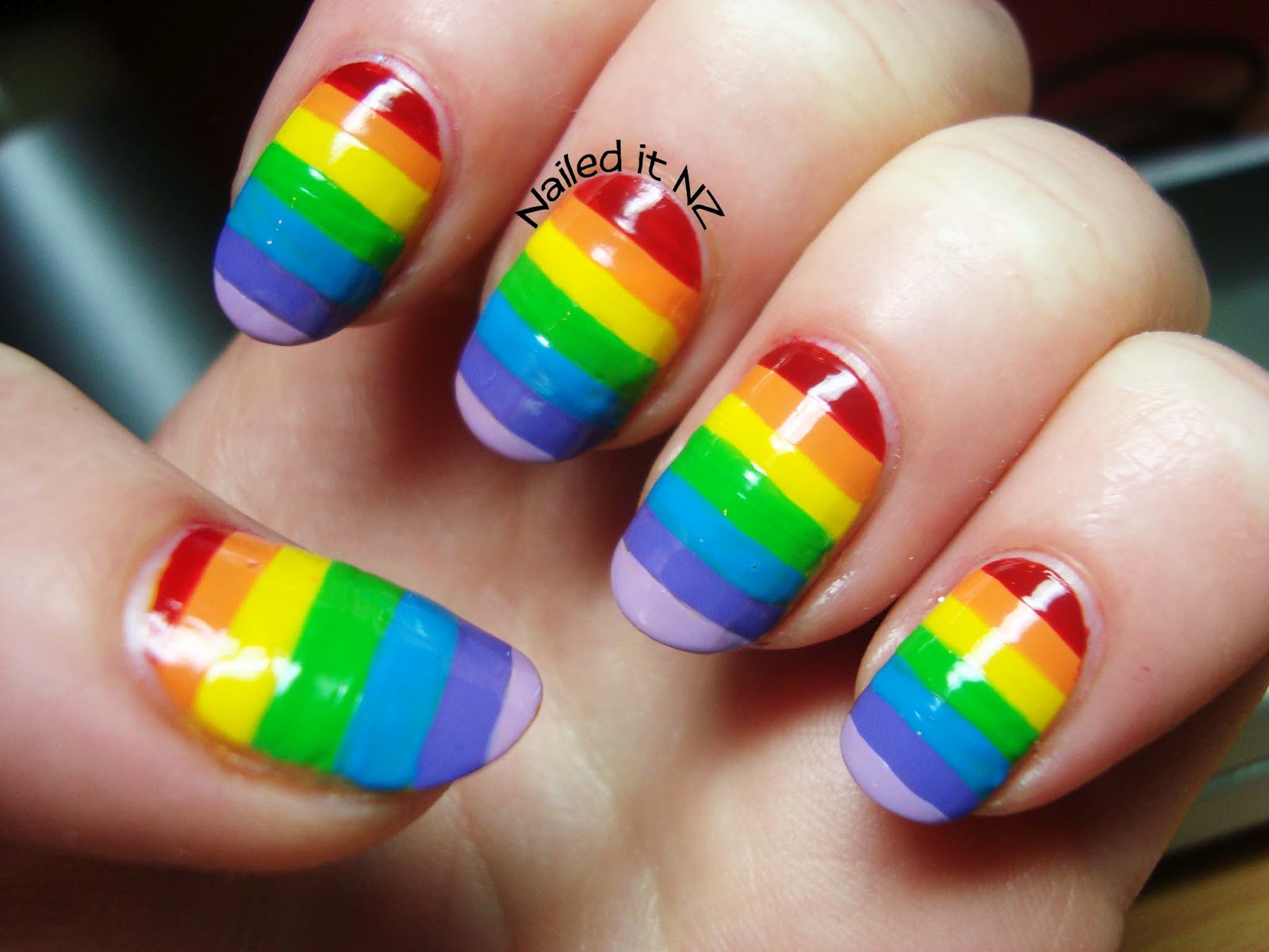 Rainbow nails and a hot pink cat!