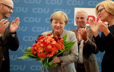 Alemaña/Eleisaun: Merkel manán, nasionalista sira iha parlamentu