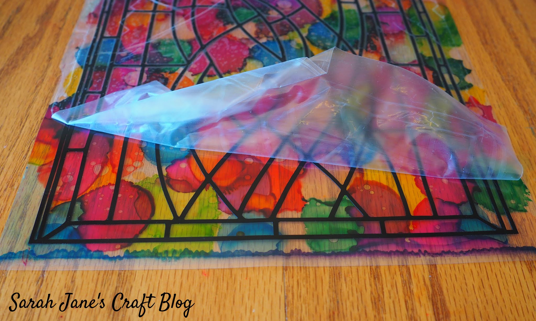 Faux Stained Glass made with Alcohol Ink, Laminating Pouches, and Vinyl