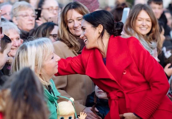 Meghan Markle wore ARITZIA Babaton Maxwell dress, and Sentaler coat, Stuart Weitzman suede pumps, Gabriela Hearst Demi bag