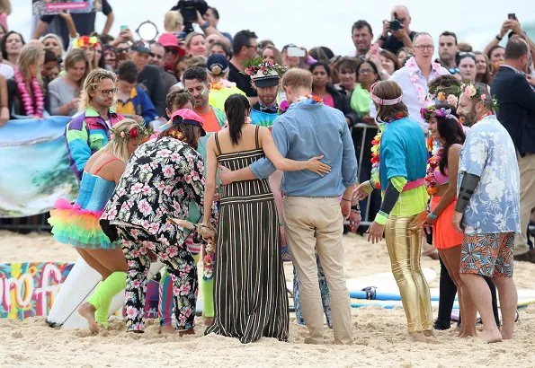 Meghan Markle wore Martin Grant Pleated Stripe Long Dress. The Duke and Duchess of Sussex visited Bondi Beach