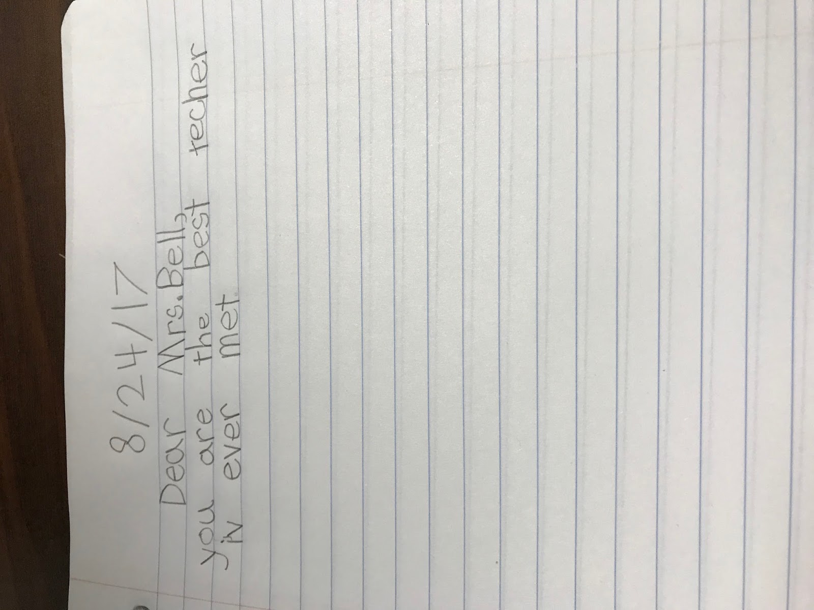 Second grade students writing in journals during spring season