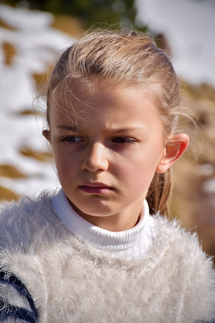 A girl showing the reasons why children are stubborn and aggressive.