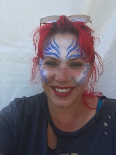 red head wearing face paint