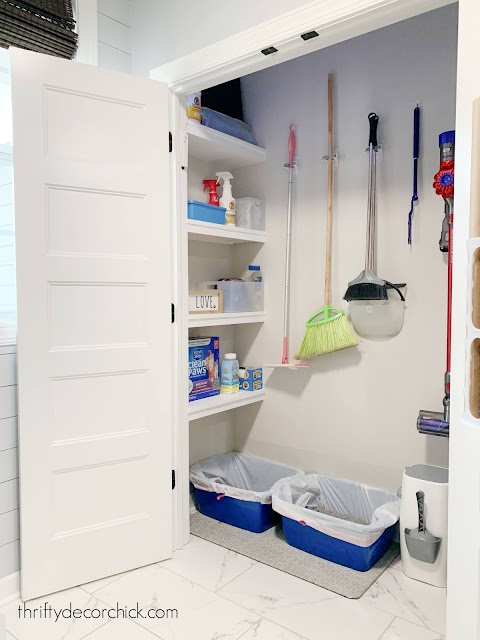 Mud room closet with cleaning supplies and cat litter