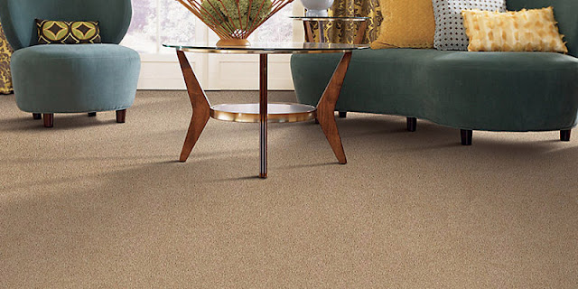 subtle textured carpet enhances this living area