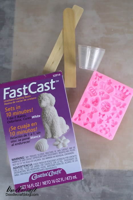 SUPPLIES NEEDED FOR PAPERCLIP BOOKMARK: FastCast Resin  Silicone Mold (crowns and bows)  Stirring sticks, Mixing cups, disposable work surface and gloves  Paperclips  Super Glue  Metallic Paint  Paintbrush  Twine or Ribbon (optional)