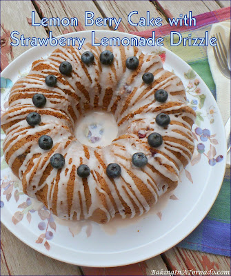 Celebrating berry season with a Lemon Berry Cake with Strawberry Lemonade Drizzle. | Recipe developed by www.BakingInATornado.com | #recipe #cake
