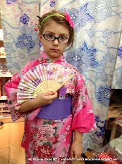 Very Young Girl wearing a childrens Japanese Robe Kimono