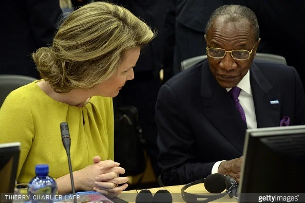Queen Mathilde of Belgium talks with Guinean President Alpha Conde during a conference on Ebola