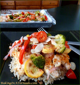 One Pan Chicken with Vegetables, a quick dinner. Chicken and vegetables drizzled with a vinaigrette and oven baked. | Recipe developed by www.BakingInATornado.com | #recipe #dinner