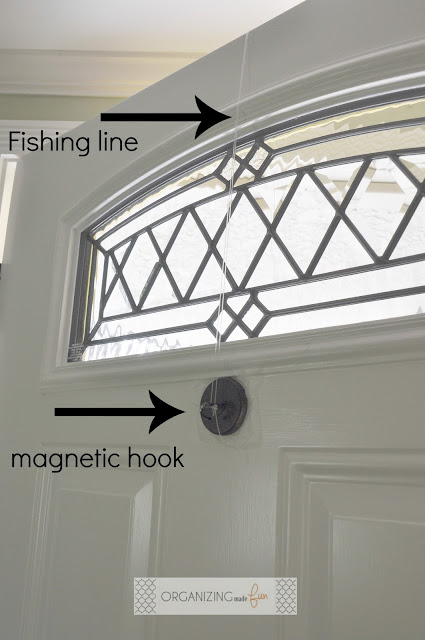 Use fishing line and a hook on the back of the door to hang wreath :: OrganizingMadeFun.com