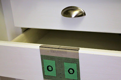 nickel plated cup pulls on white drawer