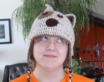 woman wearing crocheted dug hat 