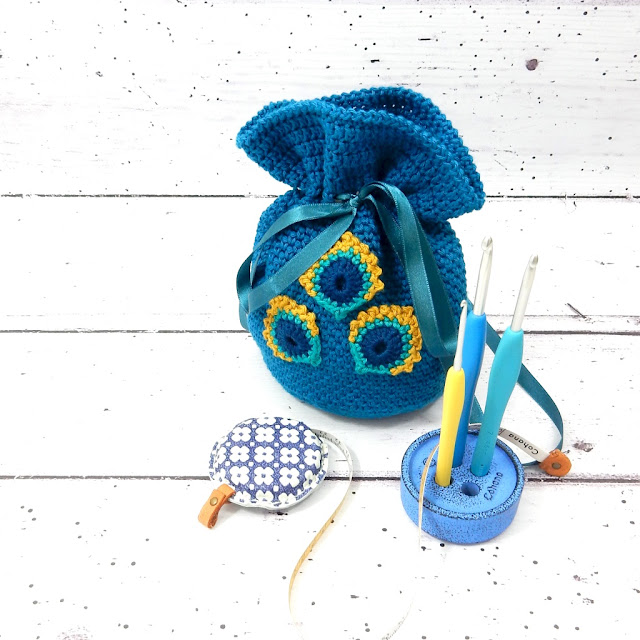 Free crochet pattern by thecuriocraftsroom gift pouch project pouch home decor peacock feather