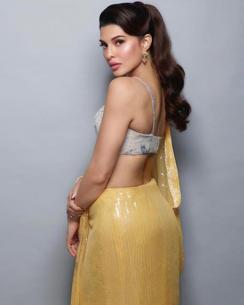 Image result for Jacqueline Fernandez in yellow sequined saree