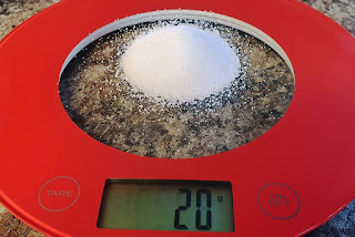 Showing twenty grams of salt on a digital scale