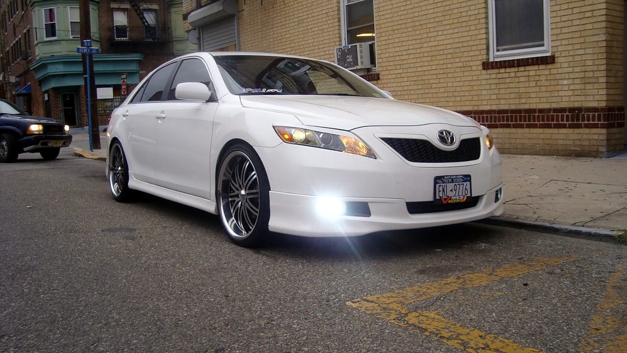 White toyota camry with black rims
