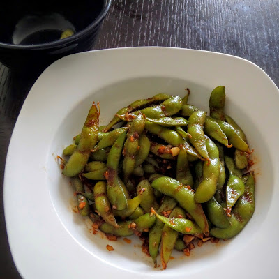 Spicy Edamame:  Young soybeans, in the pod, sauteed in ginger, garlic, soy sauce, and sriracha.  A spicy, salty, and nutritious snack.