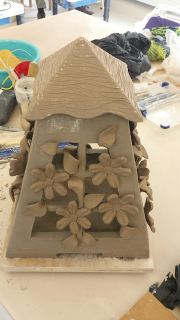 Pottery lantern with clematis design in progress by Lily L.