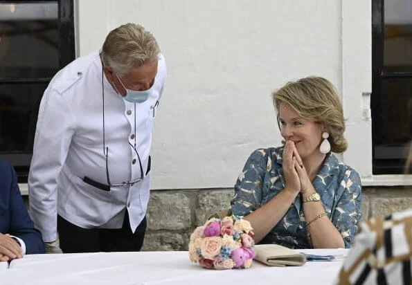 Queen Mathilde wore a new leaves printed floral half-long dress by Natan