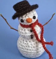 http://www.ravelry.com/patterns/library/frosty-the-snowman---amigurumi-pattern