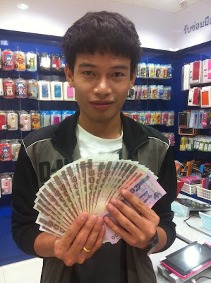 thai boy with money