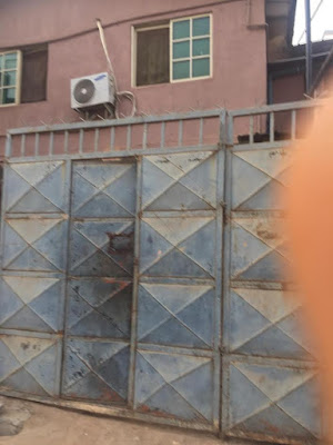 2 Photos: To hinder unwelcome guests, Landlady allegedly fixes sharp iron nails in front of her house in Lagos