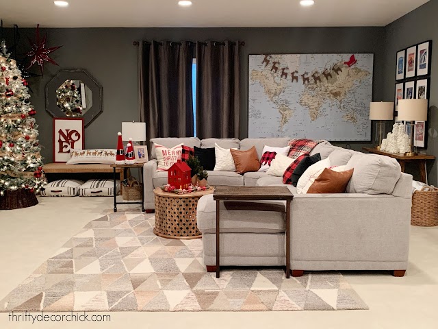 Basement family room with dark gray walls and sectional