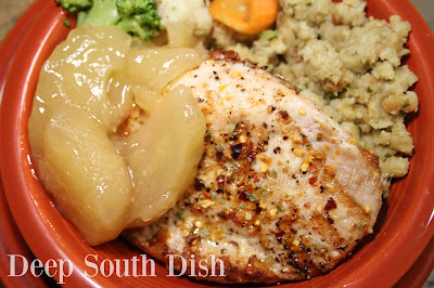 Thick-cut brined and seasoned pork loin chops, topped with skillet fried apples, or a homemade or canned apple pie filling, and baked in the oven.