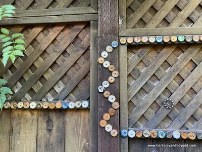 fence decorated with recycled bottle caps at The Art Studio in Nevada City, California