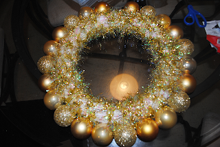 A Pinterest-inspired DIY for making a Christmas ornament wreath.