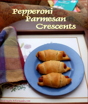 Pepperoni Parmesan Crescents are a quick snack for an afternoon with a book, or just as easily served as an appetizer. | Recipe developed by www.BakingInATornado.com | #recipe #snack