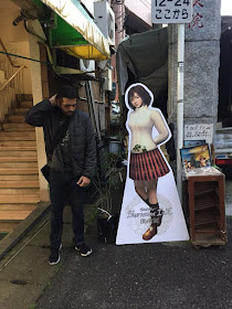 Ryo being typically awkward around Nozomi! Taken outside Hanamatsu florist (image via the project's Twitter account).