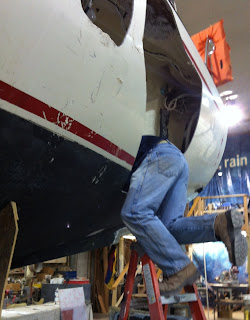 John Cherubini Jr. repairing steering on Raider 33 sailboat damaged in Superstorm Sandy