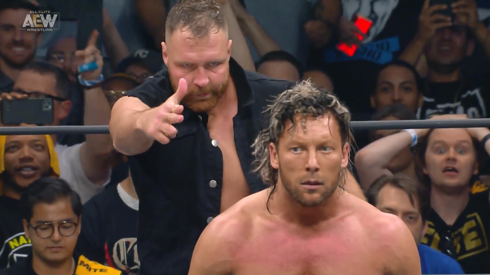 Moxley and Omega brawl around the area with a mop being used for a bit of a...