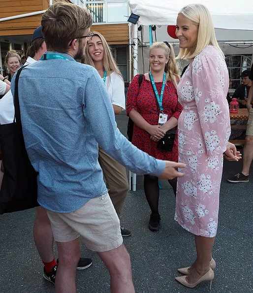 Crown Princess Mette-Marit wore ALTUZARRA double breasted sleeveless coat and she wore byTiMo pink Flared Midi Dress