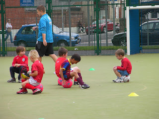 sitting on footballs