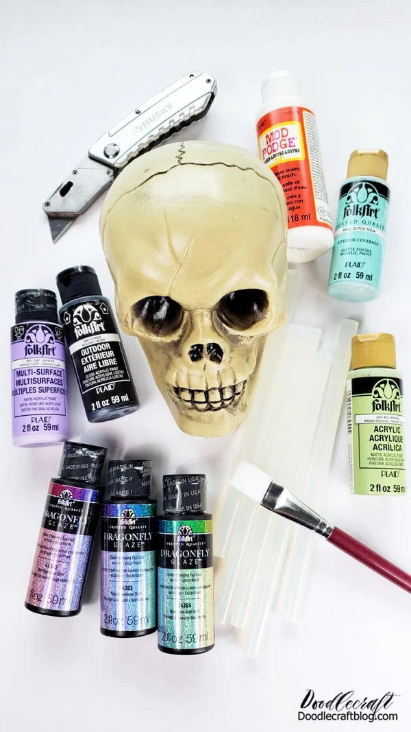 Supplies Needed for the Iridescent Skull: Plastic Skull Black Outdoor FolkArt Paint FolkArt Dragonfly Glaze Paint (at least 3 varieties) Paint Brushes