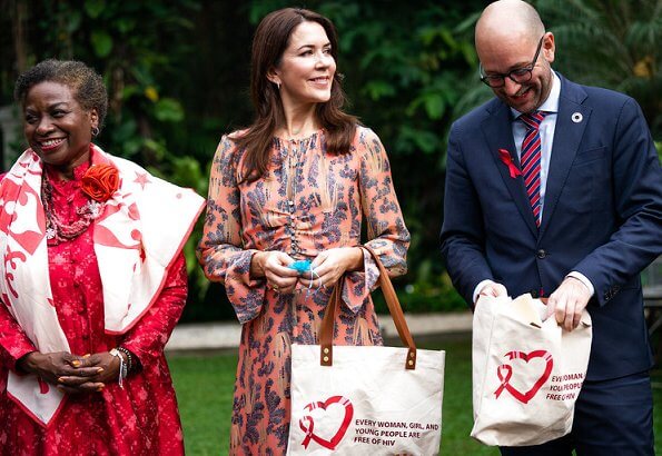 Crown Princess Mary wore sil dress by H&M. Minister Rasmus Prehn and Executive Director UNFPA Natalia Kanem