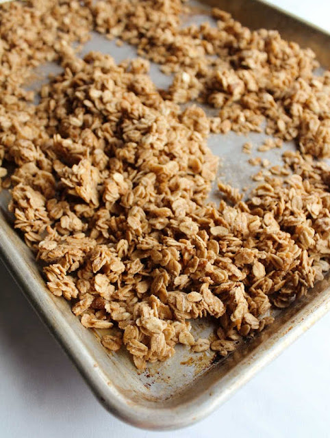 Homemade granola is so much cheaper than store bought and tastier too! Besides it is so easy and you can customize it. This version is our absolute favorite! sheet pan of granola fresh from the oven