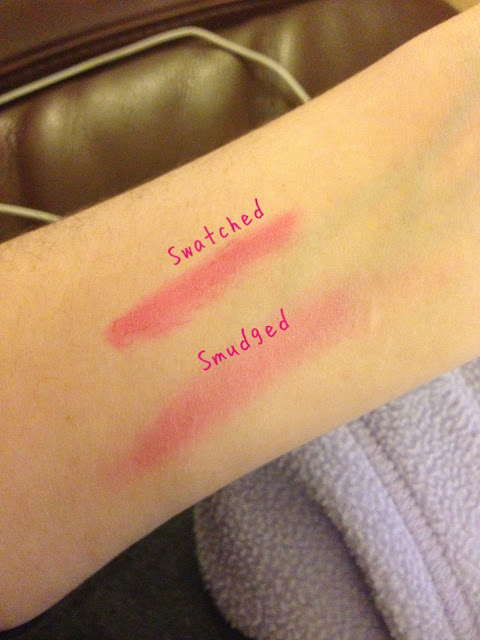 A picture of Revlon Just Bitten Lip Stain applied to an arm twice. One of the swatches is rubbed in. The colour shown is lovesick which is a pink.