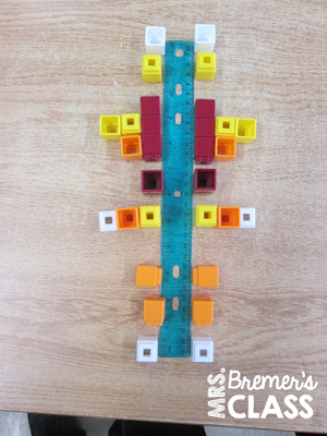 We started our fractions unit by learning about symmetry and lines of symmetry. Here's an activity that helped students learn it in a very hands-on, visual way!