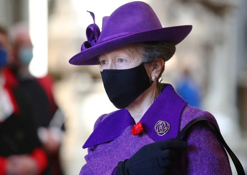 Princess Anne wore an eye-catching purple coat and matching hat, a pale lilac scarf and black knee-high boots