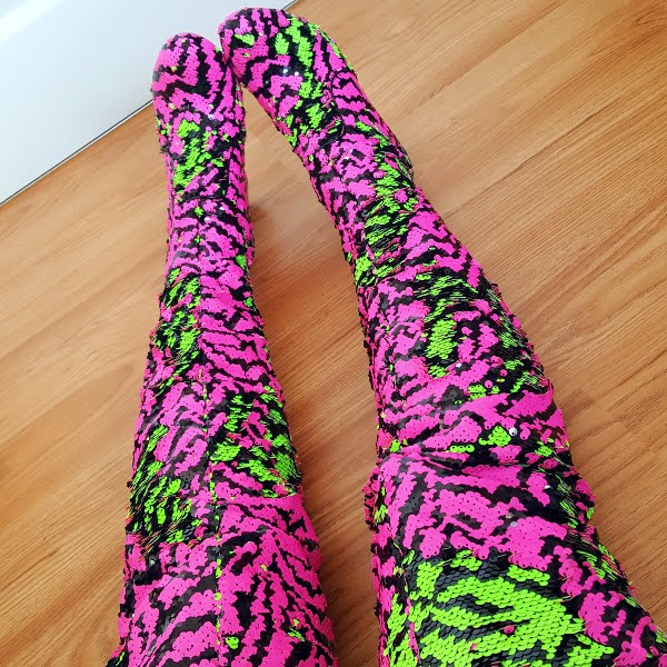 wearing brightly coloured zebra pattern sequins over the knee boots