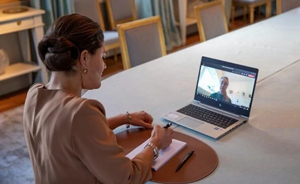 Princess Victoria wore a camel silk blouse from By Malene Birger, By Malina and Filippa K crepe blouse