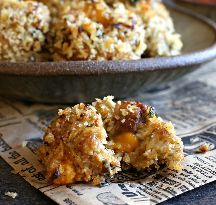 Recipe for baked rice balls made with cauliflower rice, bacon and a cheesy cheddar center.