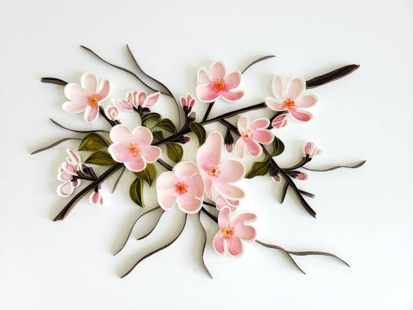 delicate pink quilled paper blossoms and branches