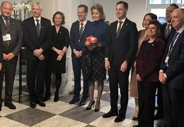 Queen Mathilde wore a new Natan dress and the queen wore a new blu jacket by Natan. United Nations Sustainable Development Goals